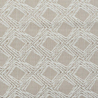 A close-up of fabric with a beige, geometric diamond motif.
