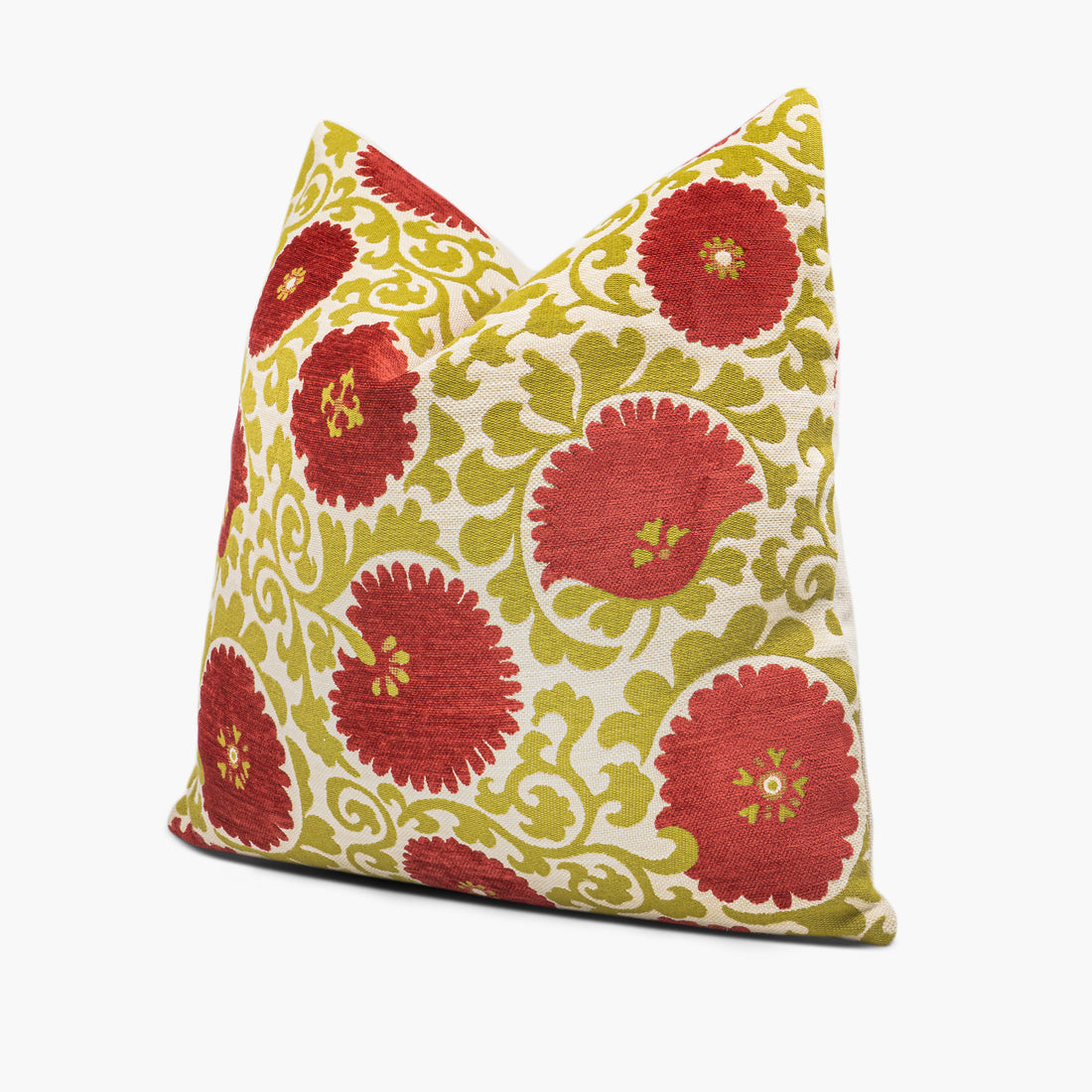 Side view of Suzani floral throw pillow cushion in coral red and green