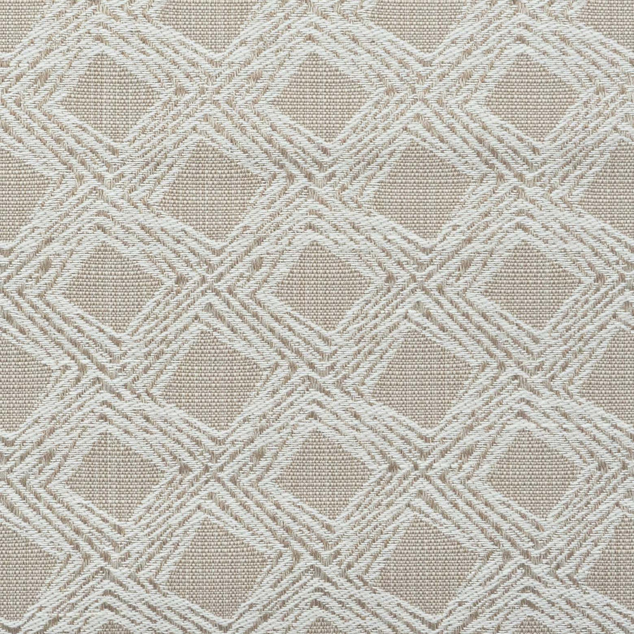 A close-up of fabric with a beige, geometric diamond motif.